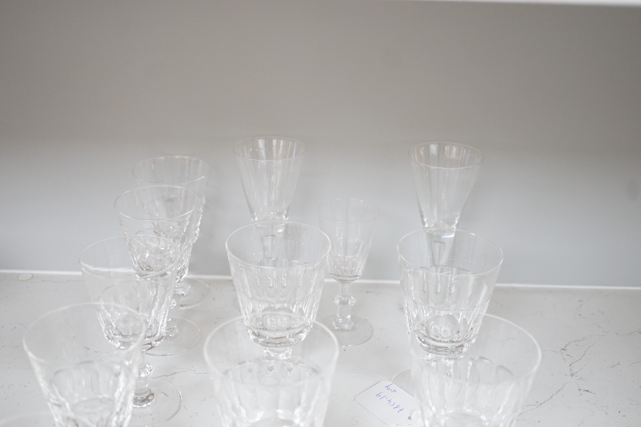 A set of nine cut drinking glasses, five similar glasses and three others